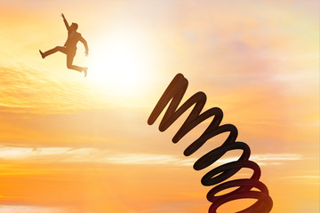 Businessman jumping from spring in promotion concept
