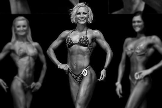 model posing in bikini on stage