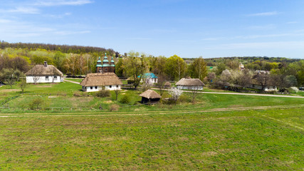 Aerial view over traditional Ukrainian village in spring, Pirogovo, KIev