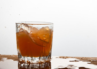 Grapefruit juice splash in glass studio isolated on white background