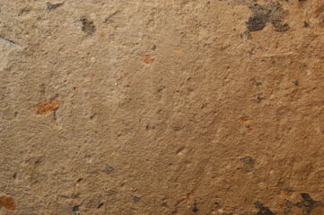 Plastered wall with sand texture. Lighting from above