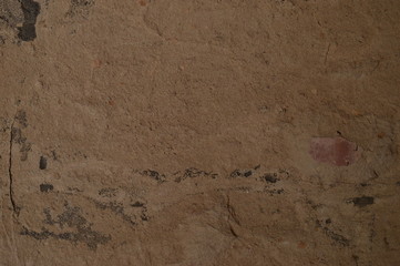 Plastered wall with sand texture. Dark. Sombre