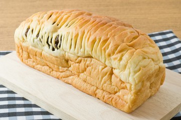 Sliced Raisin Bread on Wooden Cutting Board