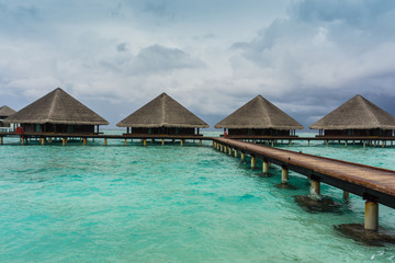 Over the water bungalows on exotic island