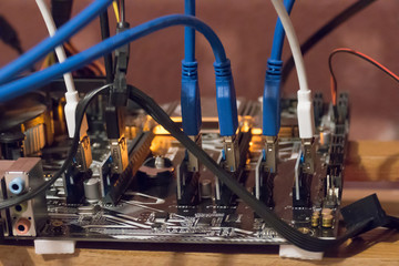   Bitcoin mining farm, working computer equipment / Network cables connected to network server, close-up 