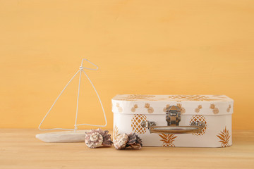 nautical, vacation and travel image with sea life style objects over wooden table.