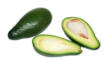 Two avocado, the whole and cut in half with bone on white background, isolated