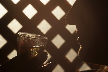 silhouette woman with a glass of vodka
