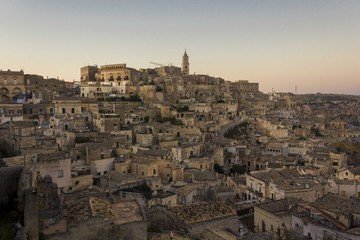 Fototapeta na wymiar Overview at sunset light of Matera city in Italy, Unesco world heritage site