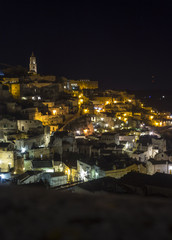 Fototapeta na wymiar Night view of the small alleys in the ancient town of Matera, Italy