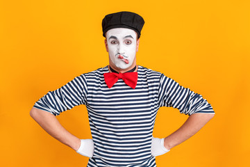 Mime man making stupid and funny face at camera