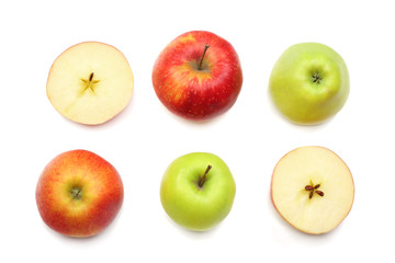 green and red apples with slices isolated on white background. top view