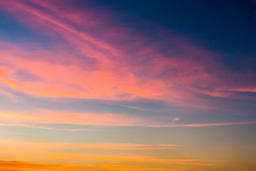 colorful dramatic sky with cloud at sunset.