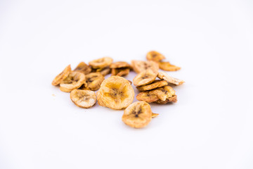 Banana chips on white background
