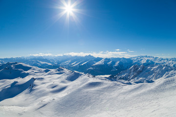View from summit Cime de Caron (3200 m.) in Les Trois Vallees France, the Worlds largest skiing area. - obrazy, fototapety, plakaty