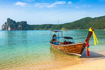 Fototapeta na wymiar Long boat and tropical beach, Andaman Sea,Phi Phi Islands,Thailand