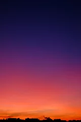 Zelfklevend Fotobehang Marvelous gradient skyline during sunset in the city © gilitukha
