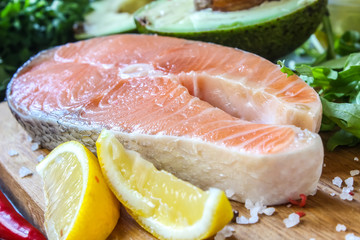 Raw salmon fillet and ingredients for cooking
