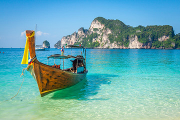 Fototapeta na wymiar Long boat and tropical beach, Andaman Sea,Phi Phi Islands,Thailand