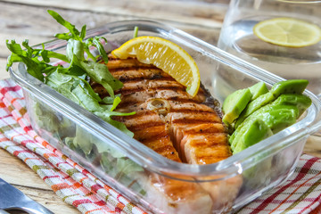 plate of grilled salmon steak with vegetables