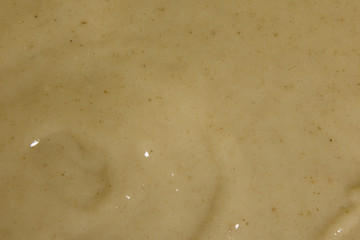 Food background of dough for pancakes macro