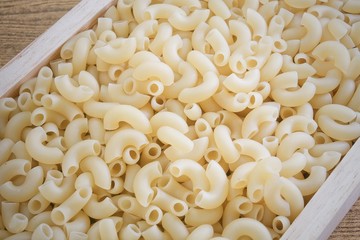 Elbow Macaroni or Gomiti Pasta in Wooden Tray