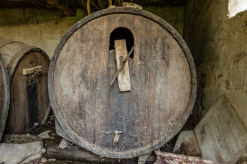 Old abandoned dusty wooden barrel