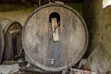 Fotobehang Old abandoned dusty wooden barrel © zaklina69