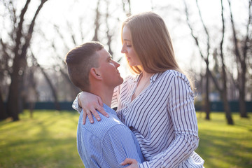 Fototapeta premium Young couple in love hugging each other on nature background. Lo