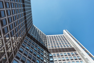 Fototapeta na wymiar Old office building against blue sky