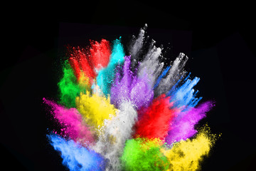 Fototapeta na wymiar Explosion of colored powder on black background