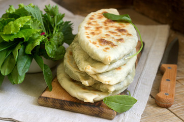 Baker making traditional dish of Armenians from Artsakh Zhingyalov hats is a type of flatbread stuffed with herbs.