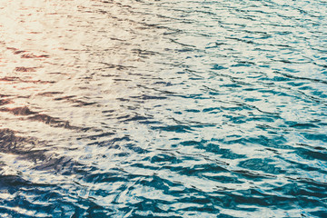 Waves water texture of the sea at sunset