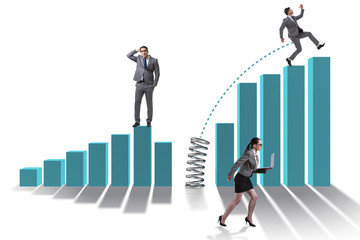 Business people jumping over bar charts