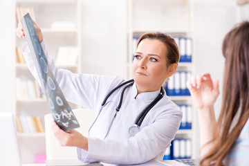 Pregnant woman visiting doctor for regular check-up