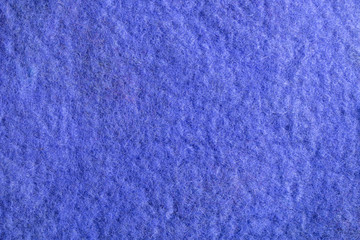 Background of felted natural merino wool close-up