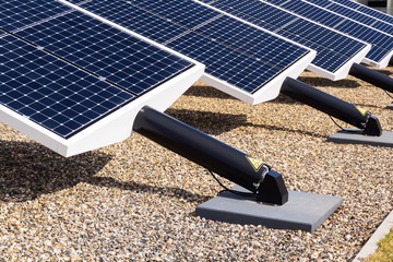 Blue rotating solar panels tilted axis tracker, future innovation energy concept