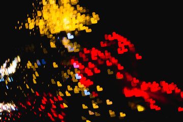The bokeh of heart shape from the beautiful colourful light decoration at night