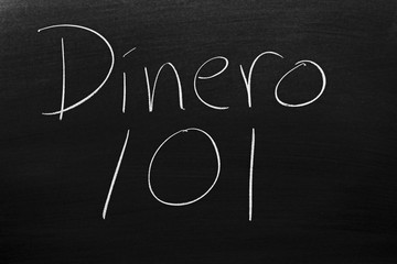 The words Dinero 101 on a blackboard in chalk