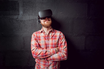 The young man wearing virtual reality goggles