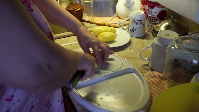 a woman prepares soup