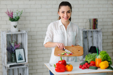 Young Woman Cooking. Healthy Food - Vegetable Salad. Diet. Healthy Lifestyle. Cooking At Home. Prepare Food