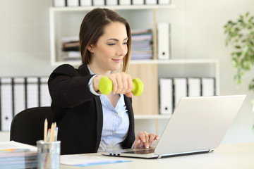 Executive exercising and working at office