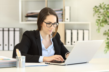 Single office worker working online with a computer