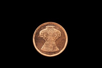 A macro image of a five piastre coin from Egypt isolated on a black background