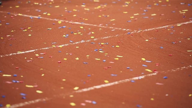 Detail show with confetti on a tennis clay court