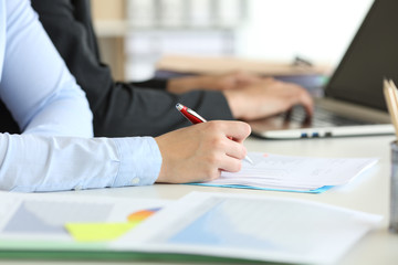 Two office worker hands working online