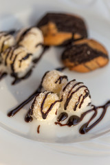 Coconut balls with chocolate sauce