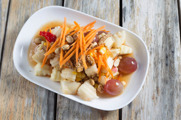 Salad of spicy apples with fried fish