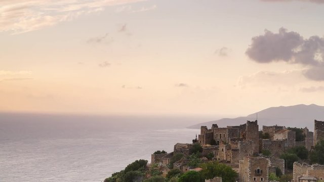 Greece Vatheia village. Architectural and historical old traditional abandoned tower houses in Vathia on Mani Peninsula. Laconia Peloponnese, Europe. Time lapse